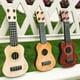 thumbnail image 3 of BRIGHTFUFU 2pcs Simulación de guitarra pequeña Ukulele Educación temprana Ukulele Kids Musical Learning Toy, 3 of 8