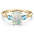 thumbnail image 3 of Gem Stone King 10K Yellow Gold Simulated White Opal and Swiss Blue Topaz 3-Stone Ring for Women | 1.30 Cttw | Oval Cabochon 8X6MM | Gemstone October Birthstone | Size 8, 3 of 6
