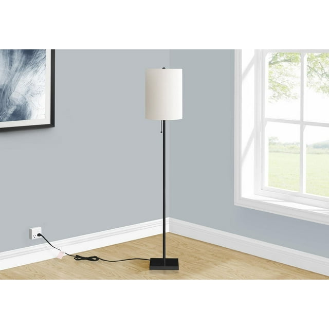 Contemporary floor lamp with 62-inch black metal stand and ivory cream cylindrical shade placed in a bright corner room.