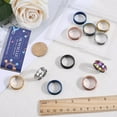 thumbnail image 4 of 1 caja de 12 anillos de acero inoxidable con incrustaciones, tamaño 9, ranurados en azul, negro y dorado, con inscripción láser, lisos., 4 of 9
