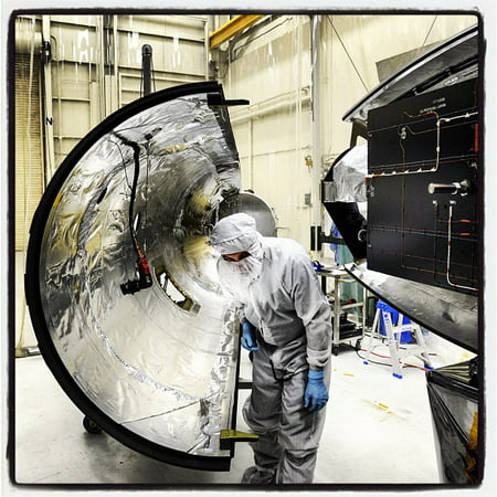 LAMINATED POSTER Orbital Sciences team members move the second half of the payload fairing before it is placed over N Poster Print 24 x