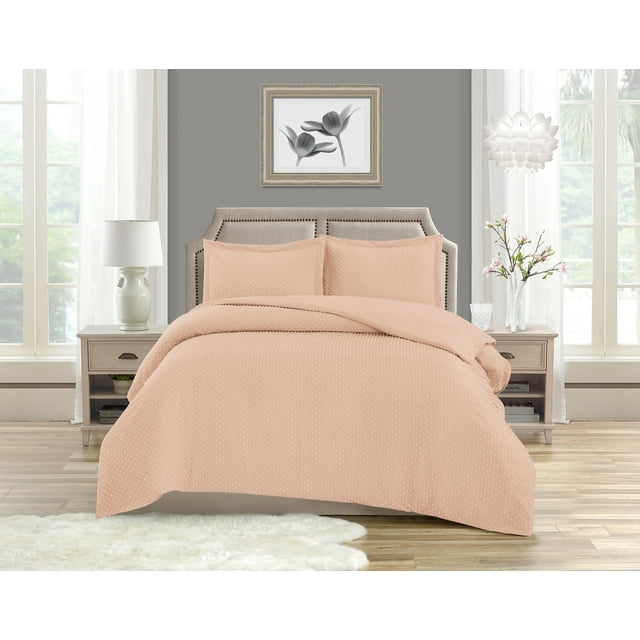 Twin bed dressed in pink Swift Home Dot Clip textured duvet cover set with zipper closure and matching pillow shams, featuring soft all-season bedding on an upholstered beige headboard.
