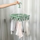 thumbnail image 4 of Colgador para organizador de calcetines con 32 clips de acero inoxidable | Estante de plástico para guardar espacio para ropa interior, medias, corbatas, bufandas, solución de almacenamiento, 4 of 7