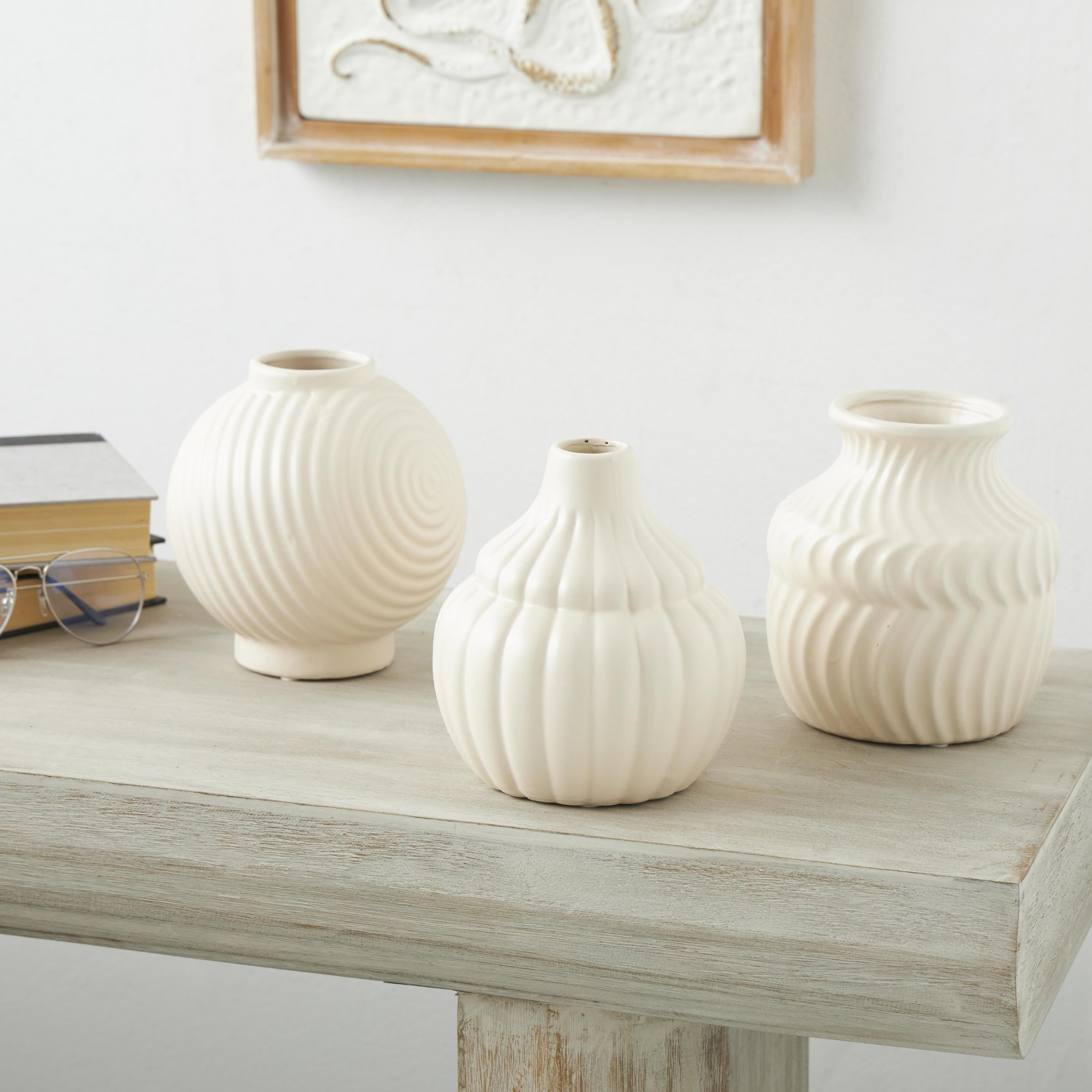 DecMode 5"W, 6"H Abstract Small Textured Cream Ceramic Vase with Varying Shapes and Patterns, Set of 3