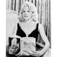 thumbnail image 1 of Carroll Baker poses for press holding Jean Harlow book 5x7 inch photo, 1 of 1