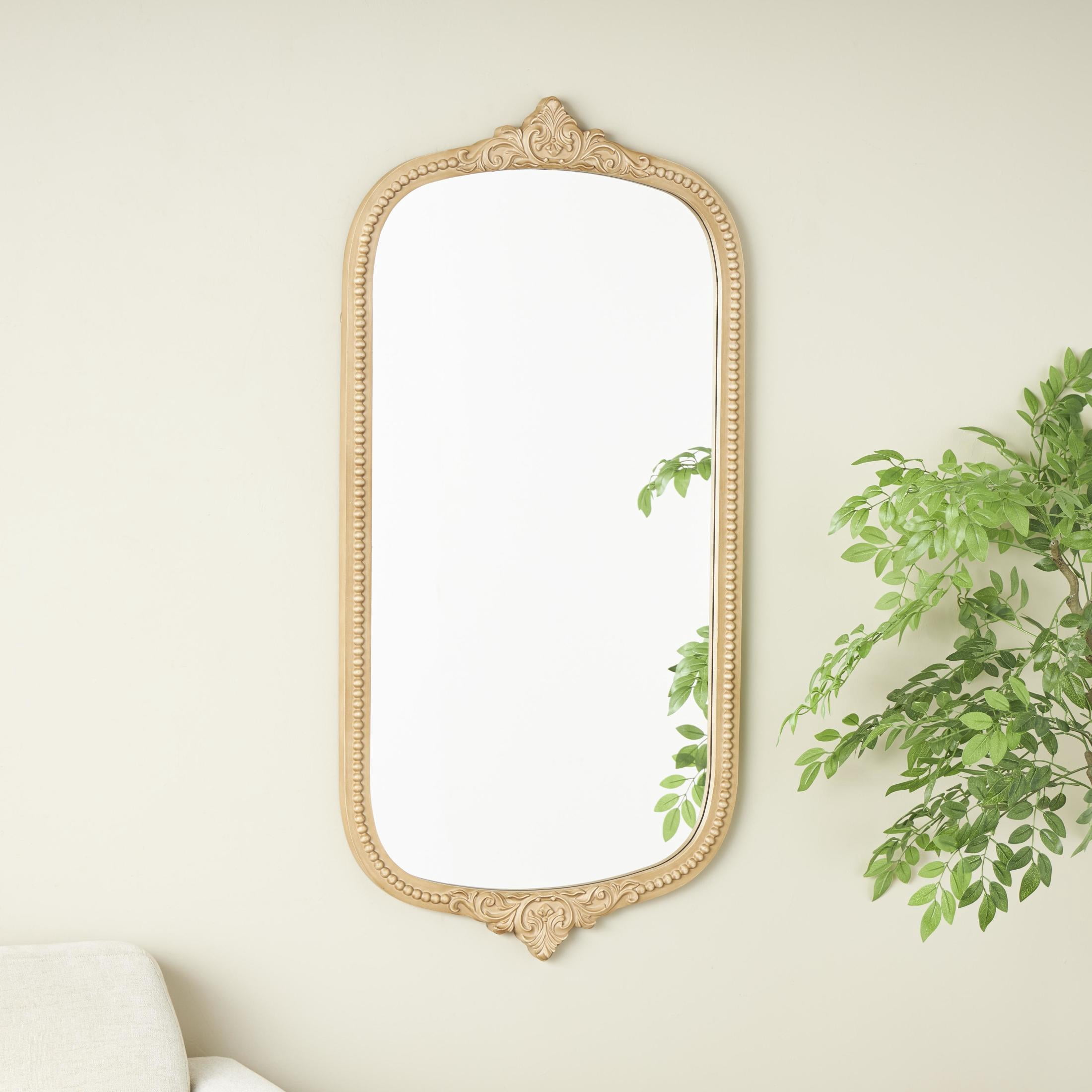 DecMode 24" x 48" Light Brown Oval Scroll Wall Mirror with Beaded Frame