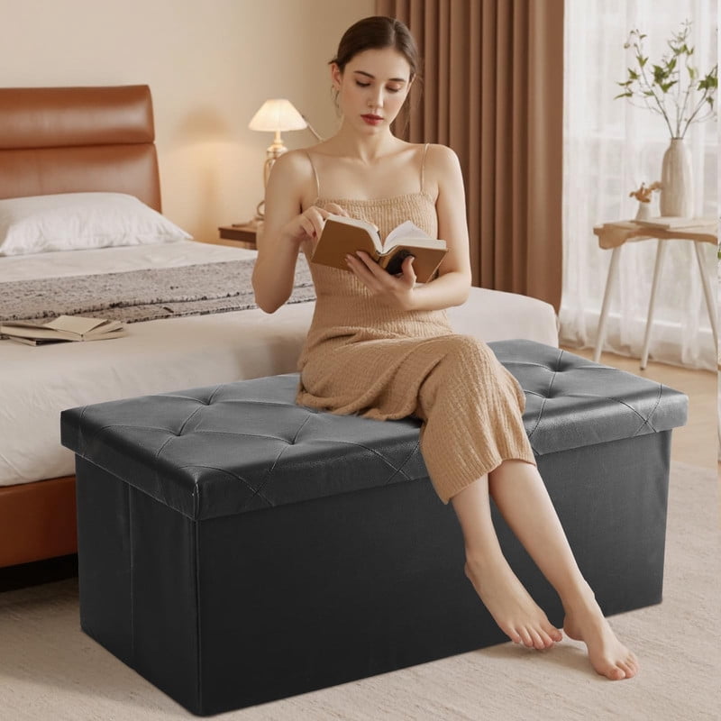 Telyra 43" Foldable Storage Ottoman Bench Faux Leather Footrest Stool with Foam Padded Seat, Black