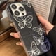 thumbnail image 4 of Funda de mariposa con purpurina negra compatible con iPhone 13 Pro Max, diseño coreano 3D con mariposa hueca y tarjeta plateada brillante para mujeres y niñas., 4 of 8