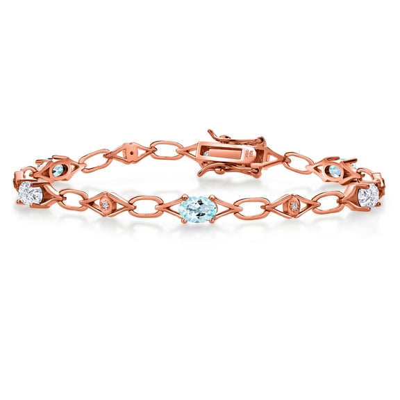 Gem Stone King 18K Rose Gold Plated Silver Sky Blue Topaz and White Moissanite and Round White Lab Grown Diamond Tennis Bracelet for Women (3.04 Cttw, Gemstone Birthstone, Oval 6X4MM, 7.25 inches)