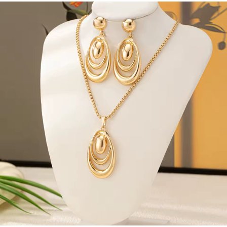Trendy pierced gold cutout pendant necklace and earring set
