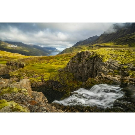 Rugged Icelandic landscape with bright green tundra and a view of the coastline in the distance; Iceland Poster Print by Robert Postma / Design Pics