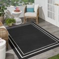 thumbnail image 3 of Nourison  Sandy Indoor / Outdoor Solid Area Rug Black/Ivory 10' x 14' 10' x 14' Black Rectangle, 3 of 5
