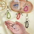 thumbnail image 3 of 6 llaveros católicos de 6 colores con cuentas de rosario de agua bendita, llavero con botellas de agua bendita, crucifijo y bolsas de organza., 3 of 6