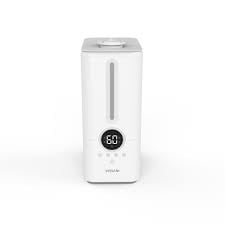 Vissani 1.5 Gal. Ultrasonic Humidifier in a modern white design, equipped with a digital display, 360-degree turning dual nozzle, and ultrasonic technology for quiet, cool mist distribution. Features an aromatherapy tray for essential oils, a transparent top-fill tank, and a 50-hour runtime, ideal for spaces up to 450 sq. ft. Perfect for creating a soothing, spa-like environment.