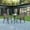 Brown, variant on BizChair 5 Piece Outdoor Patio Dining Set - 31.5" Square Tempered Glass Patio Table, 4 Black Flex Comfort Stack Chairs