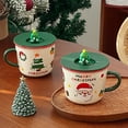thumbnail image 1 of Santa Design Ceramic Holiday Coffee Mug With Lid And Festive 3D Topper Featuring Green Handle For Merry Family Theme 340ml Capacity, 1 of 4