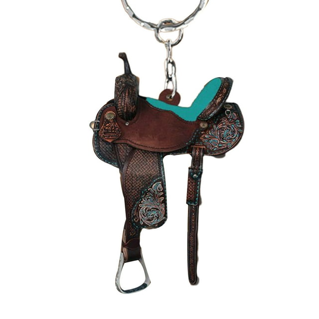 Trayknick Key Chain Multifunctional Decorative Personalized Fashion Western Cowboy Saddle Acrylic Pendant for Horses Lover. This eco-friendly acrylic key chain features a detailed saddle design with intricate patterns and a turquoise accent. Ideal for car keys, travel accessories, or as a gift for horse enthusiasts.