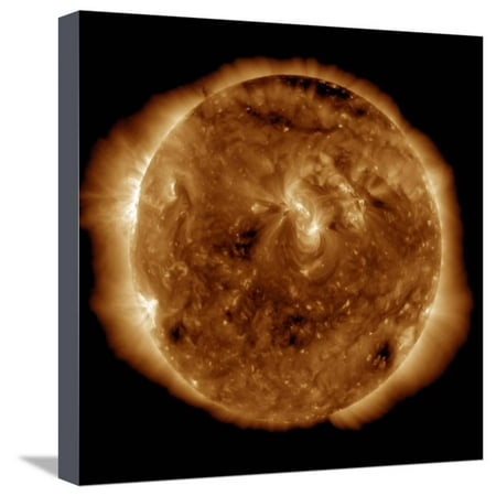 A Dark Rift in the Sun's Atmosphere known as a Coronal Hole Stretched Canvas Print Wall Art By Stocktrek