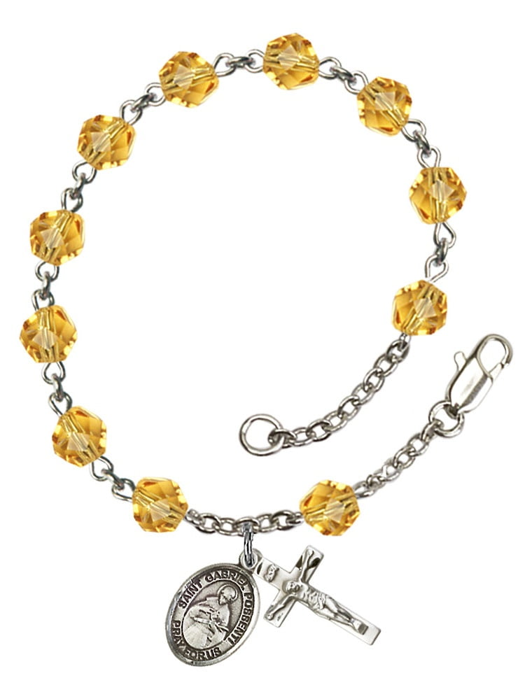 Bonyak Jewelry 18 Inch Rhodium Plated Necklace w// 6mm Blue September Birth Month Stone Beads and Saint Gabriel Possenti Charm