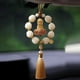 thumbnail image 5 of Colgante de espejo retrovisor para coche con estatua de Buda, regalo decorativo para el interior del coche Amarillo, 5 of 9
