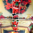 thumbnail image 4 of Santa Claus Takes Part In Christmas Tree Party Decorations By Climbing A Rope Ladder, 4 of 5