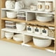 thumbnail image 1 of Estante de Cocina Ajustable, Organizador de Encimera Expandible para Platos, Tazones y Especias, Estante de Plástico Blanco para Gabinetes, 11.81-21.65 X 7.83 X 4.92 Pulgadas, 1 of 7