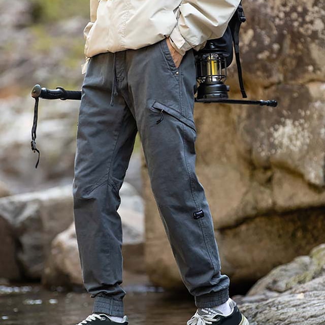 Puntoco Pantalones cargo de color sólido con bolsillos y cremallera, cintura elástica y largo completo para hombre