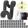 thumbnail image 1 of Ganchos Besslly para colgar ropa, 100 unidades, plástico negro, 1 of 8