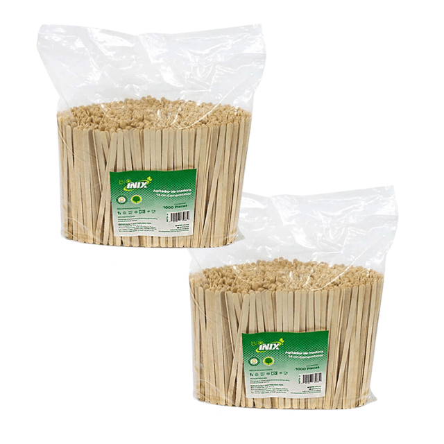 agitador inix para café de madera 14 cm 2000 pzas. Dos bolsas transparentes con 1,000 agitadores de madera cada una, color blanco roto, 14 cm de largo, palito plano con extremo redondeado y etiqueta verde con logo Inix visible; también se usan comúnmente para remover bebidas frías o como palillos para degustaciones.