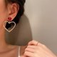 thumbnail image 5 of 1 par de aretes colgantes de cristal con forma de corazón, aretes con forma de corazón de rubí rojo, diamantes de imitación, aretes colgantes con forma de corazón de amor hueco, aretes dorados brillantes y exagerados para novia Rojo Verde, 5 of 5