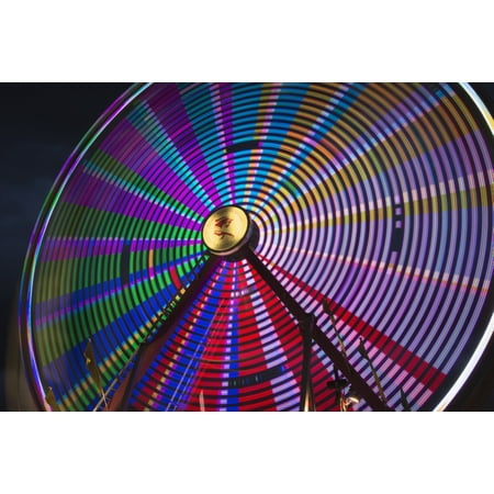 Light effect of a fairground ride at night at the Calgary Stampede Calgary Alberta Canada Stretched Canvas - Philippe Widling  Design Pics (19 x