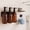 Brown-Stainless, variant on Nurforta Shampoo and Conditioner Dispenser - Shower Soap Dispenser Wall Mounted - 17 fl oz Set of 3 Gold Plastic Bottles with Stainless Steel Pumps & No-Drill Adhesive Holders for Bathroom