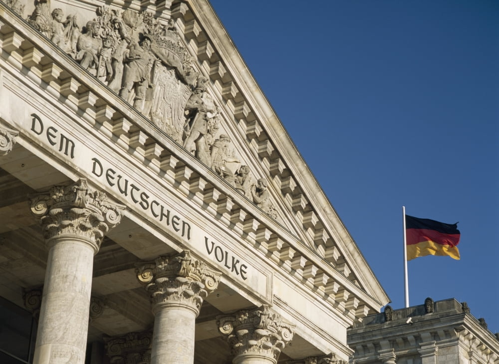 Detail Of Bundestag (Reichstag) With German Flag In Front PosterPrint by Design Pics