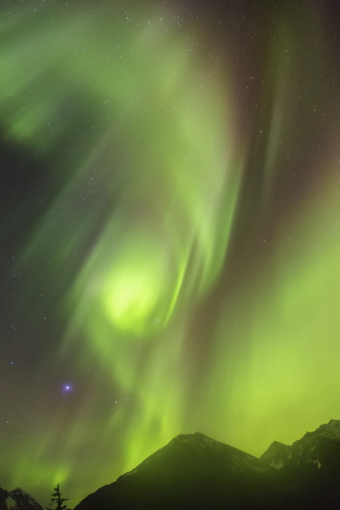 Northern Lights in the sky above Moose Pass silhouetted Kenai Mountains in the foreground fog and low clouds Fall Chugach National Forest Southcentral Alaska USA Canvas Art - Kevin Smith Design Pics