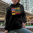 thumbnail image 2 of Distressed Eat. Sleep. Golf. Repeat. with Clubs, Golf Player, Golfing or Golfer Themed Merch Gift, Black Hooded Sweatshirt or Hoodie, Small, 2 of 5