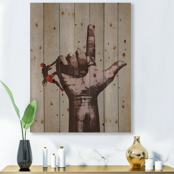 Designart 'Climber With Finger Pointing Up Sign' Modern Print on Natural Pine Wood