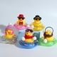 thumbnail image 1 of Adorno de coche de pato de goma, adorno de tablero de coche de pato amarillo con casco de hélice para decoraciones navideñas y decoraciones para adultos, 5 piezas ER, 1 of 5