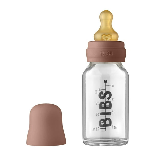 BIBS Baby Glass Bottle 110 ml in dusky lilac with anti-colic natural rubber latex nipple, clear borosilicate glass body with black measurement markings, and matching dusky lilac screw and protective caps for safe feeding.