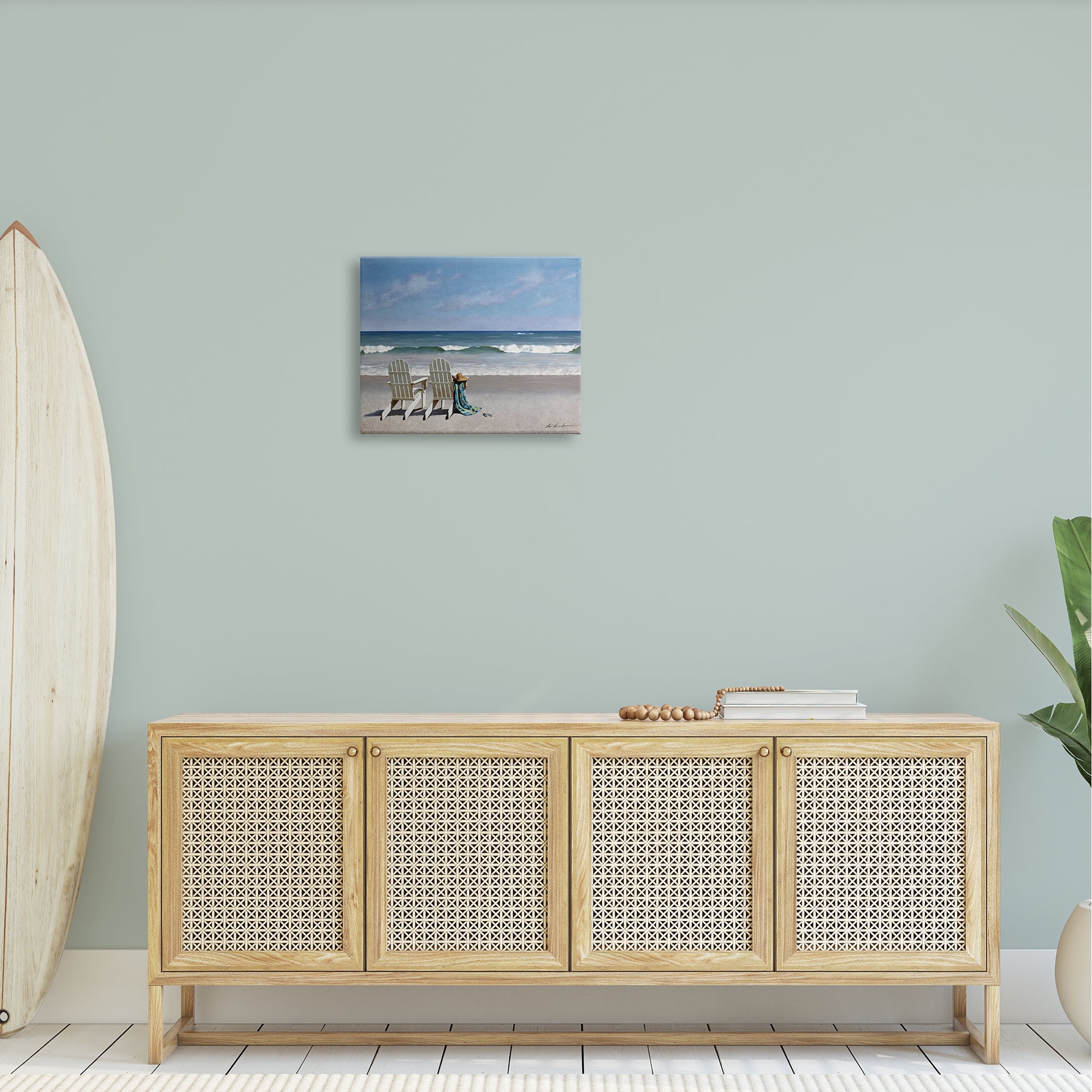 The Stupell Home Decor Two White Adirondack Chairs on the Beach Canvas Wall Art