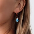 thumbnail image 3 of Gem Stone King 18K Rose Gold Plated Silver Swiss Blue Topaz and White Lab Grown Diamond Dangle Earrings for Women (5.07 Cttw, Oval Checkerboard 9X7MM), 3 of 3