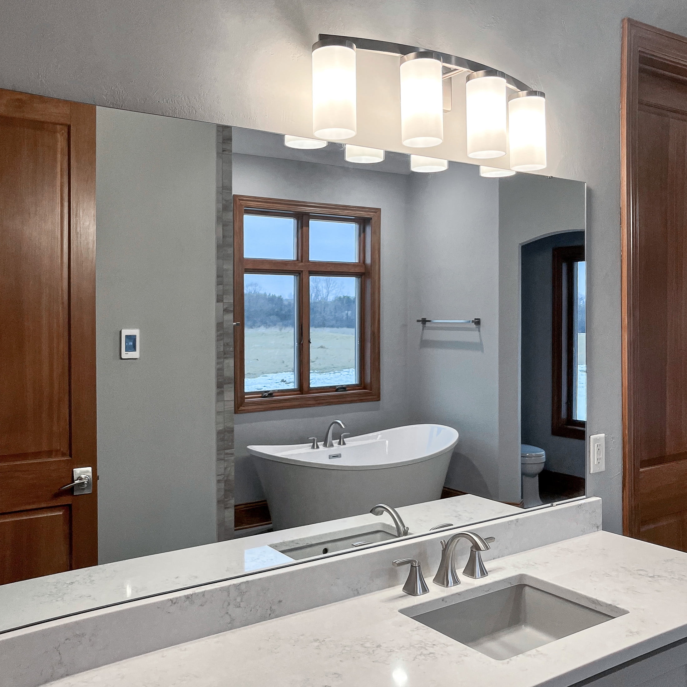 Desta 30" Satin Nickel 4-Light Dimmable Vanity Light With Curved Bar Design and Frosted Glass