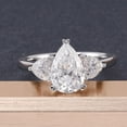 thumbnail image 4 of Oryn Jewelry 1.9 Ct Pear Cut Moissanite Ring for Women - 14K White Gold Plated Ring - Wedding Trilogy Engagement Ring - Three Stone Moissanite Ring Design, 4 of 6