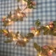 thumbnail image 4 of Cadena de Luces de Vid de Rosas con Pilas Luces de Cadena de Color Blanco Cálido para Uso en Interiores ANGGREK  Otros, 4 of 7