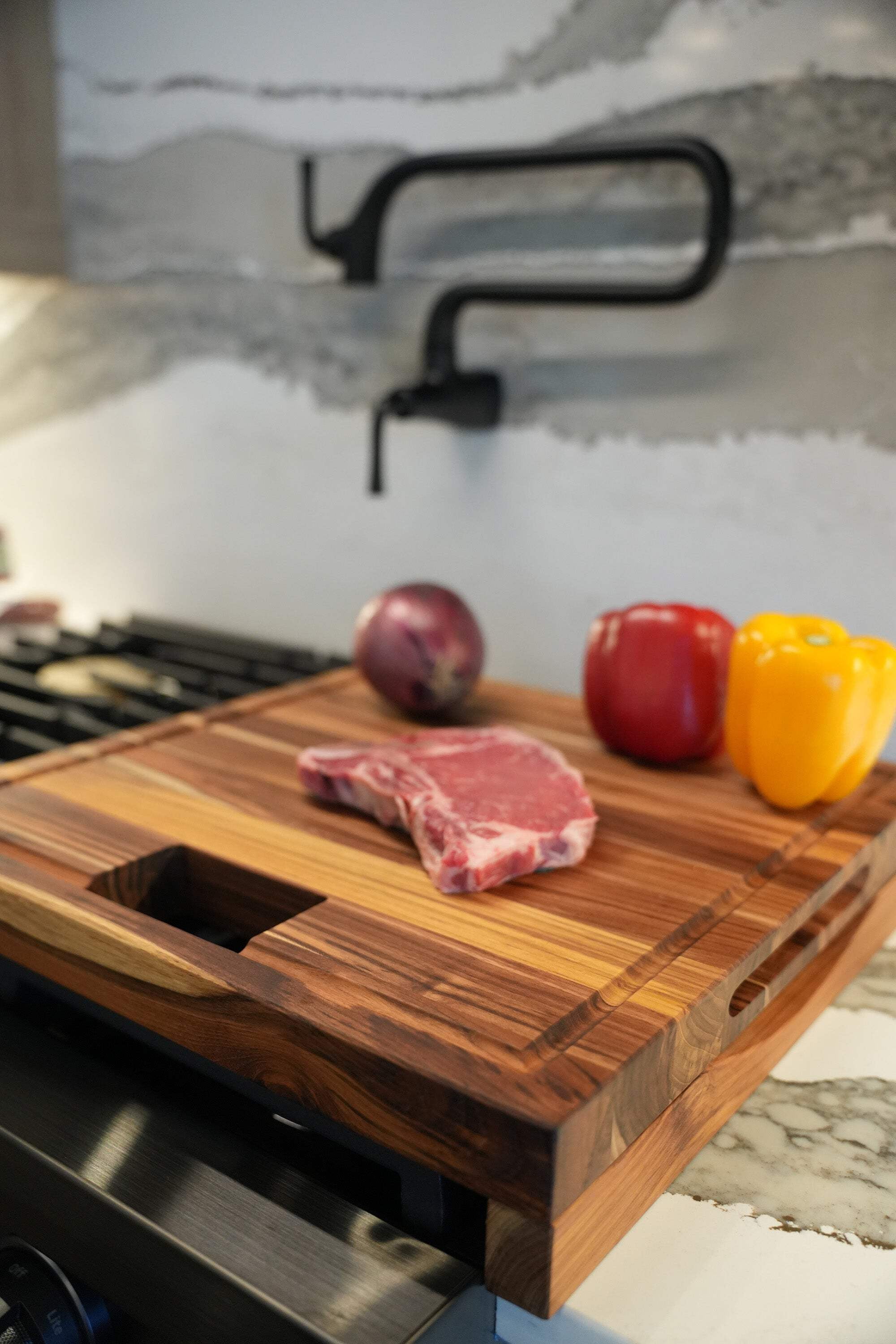 EcoDecors 17" x 18" FSC Teak Edge Grain Cutting Board with Groove  Handle