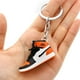 thumbnail image 1 of LLavero de Mini zapatillas de deporte 3D exquisito para fanáticos, llavero de recuerdo, colgante de llave de teléfono móvil, modelo exquisito, regalos decorativos, 1 of 4
