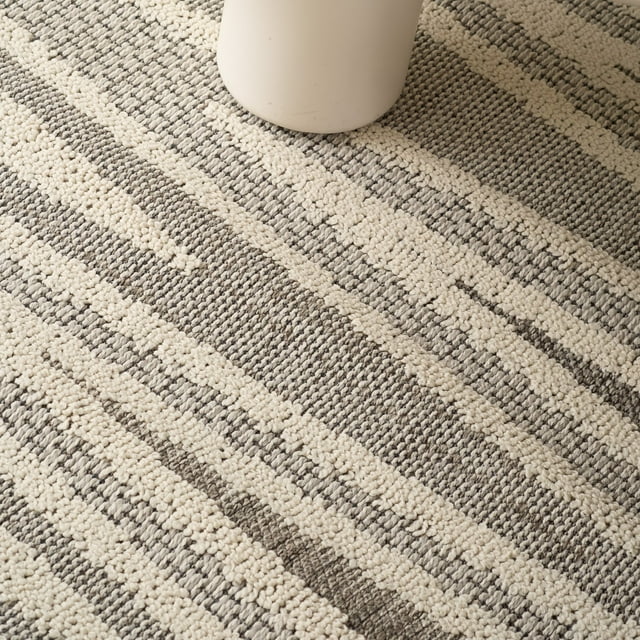 Textured grey and cream striped abstract area rug suitable for living room, bedroom, dining room, or kitchen.