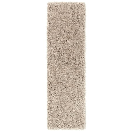SAFAVIEH Classic Shag SG240D Handmade Taupe Rug SAFAVIEH Classic Shag SG240D Handmade Taupe Rug With a hint of high fashion this plush shag area rug encourages your bare feet to stroll through luxury. These contemporary rugs have been hand-tufted using uber-soft synthetic yarns for a timeless aesthetic. Rug has an approximate thickness of 1.75 inches. For over 100 years  SAFAVIEH has set the standard for finely crafted rugs and home furnishings. From coveted fresh and trendy designs to timeless heirloom-quality pieces  expressing your unique personal style has never been easier. Begin your rug  furniture  lighting  outdoor  and home decor search and discover over 100 000 SAFAVIEH products today.