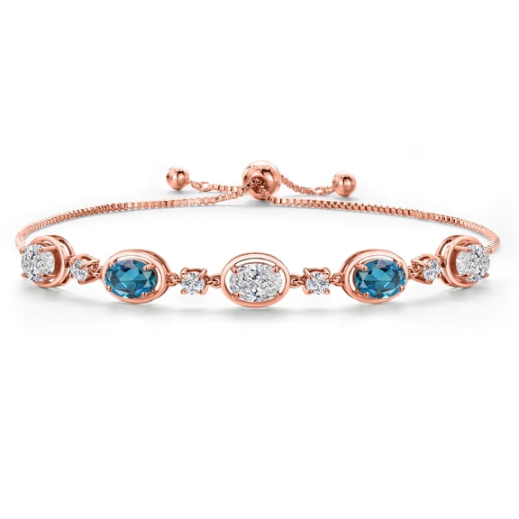 Gem Stone King 18K Rose Gold Plated Silver White Lab Grown Diamond and London Blue Topaz Bracelet for Women | 4.10 Cttw | Gemstone April Birthstone | Oval 7X5MM | Fully Adjustable 9 inch