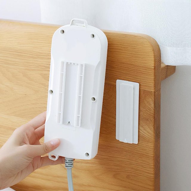 Soporte para regleta de alimentación de montaje en pared Adhesivo sin costuras Autoadhesivo Rack de enchufe para el hogar