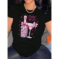thumbnail image 1 of Camiseta negra festiva para mujer con lazo rosa y estampado de champán y fuegos artificiales. Cuello redondo y manga corta. Cómoda mezcla de algodón. Ideal para celebraciones de Año Nuevo. Camiseta de, 1 of 6